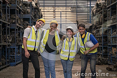 Group Engineers or technicians are inspecting auto parts in warehouses and factories. Team of workers and engineer celebrating in Stock Photo