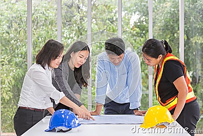 Group engineers working meeting room at the office. Team workers are talking construction plan. Electricians carpenter or Stock Photo