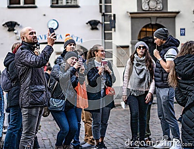 Group of european tourists watching landmark at the street with luggage Editorial Stock Photo