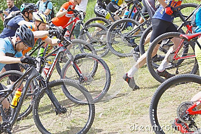 Group of fighting male mountain bike cyclists leading cycle uphill Editorial Stock Photo