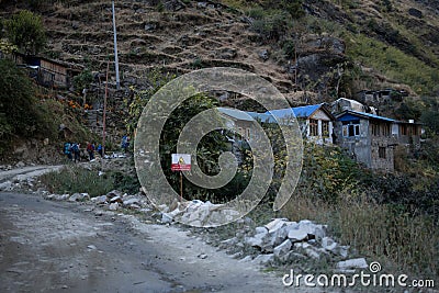 Group of five people trekking to a small mountain village Editorial Stock Photo