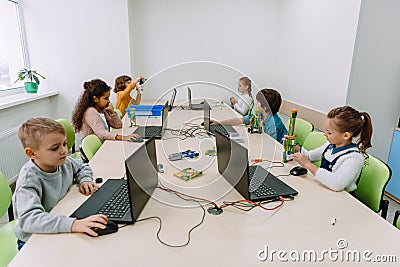 group of focused kids working with computers Stock Photo