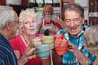Group of Four Seniors Celebrating Stock Photo