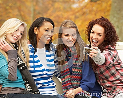 Group Of Four Teenage Girls Taking Picture Stock Photo