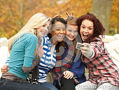 Group Of Four Teenage Girls Taking Picture Stock Photo