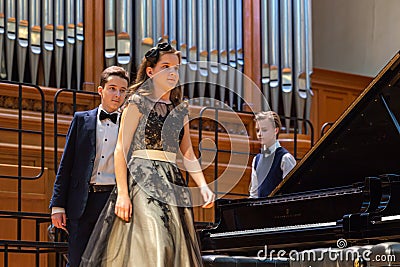 Group of four young pianists on stage before the performance. Editorial Stock Photo