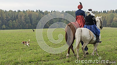 Group of fox hunters on the horses in the autumn field. Reconsruction of traditional horse hunting Editorial Stock Photo