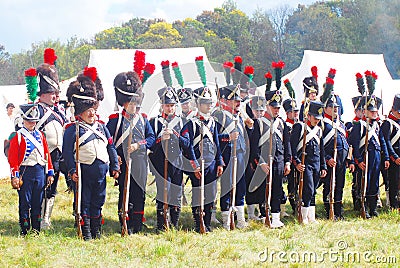 A group of French (Napoleonic) soldiers-reenactors standing in a row. Editorial Stock Photo