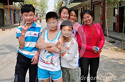 Wan Jia, China: Friendly Children in Village Editorial Stock Photo
