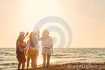 Group of friends play on the beach Stock Photo