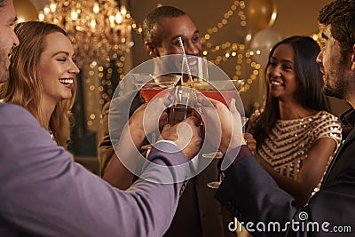 Group Of Friends With Drinks Enjoying Cocktail Party Stock Photo