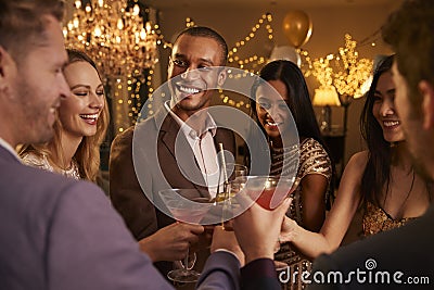 Group Of Friends With Drinks Enjoying Cocktail Party Stock Photo