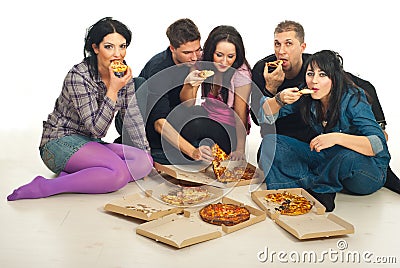 Group of friends eating pizza Stock Photo