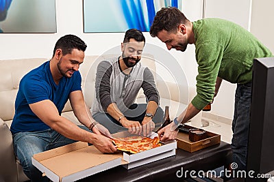 Group of friends eating pizza Stock Photo