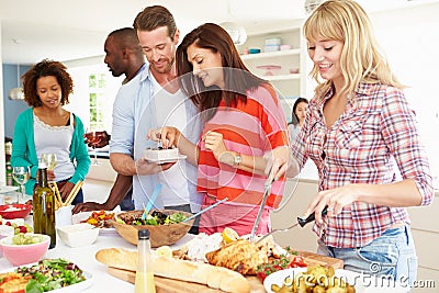 Group Of Friends Having Dinner Party At Home Stock Photo