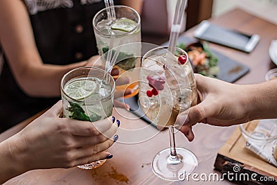 Group of friends having fun and drink cocktails. Stock Photo