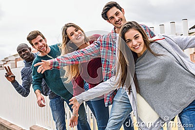 Group of friends having fun together outdoors Stock Photo