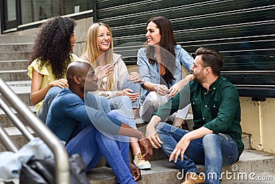 Group of friends having fun together outdoors Stock Photo