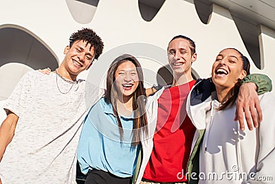 Group of friends having fun together outdoors. Portrait of multiethnic young students looking at the camera Stock Photo