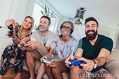 Group of friends play video games Stock Photo