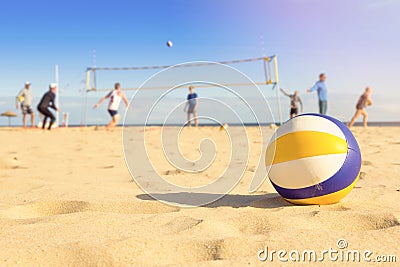 Group of friends playing beach volleyball Stock Photo