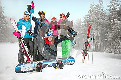 Group of friends skiers and snowboarders having fun on snowbound Stock Photo