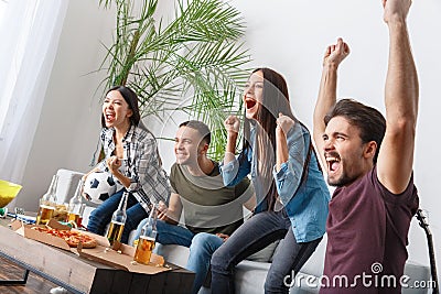 Group of friends sport fans watching match cheering team Stock Photo