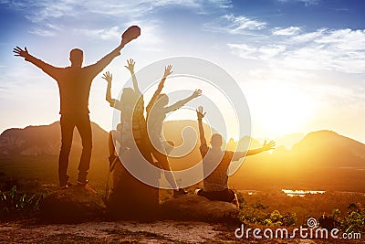 Group friends sunrise mountains happy Stock Photo