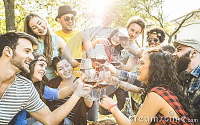 Group of friends toasting wine having fun at barbecue garden party Stock Photo