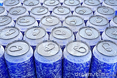 Group of frozen blue aluminum energy drink cans from above close up full frame Stock Photo