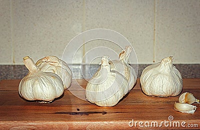 Group Of Garlic Cloves Up Close Wooden Chopping Board Stock Photo