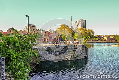 Group of girls having a picnic beside the Shadwell Basin on sunn Editorial Stock Photo