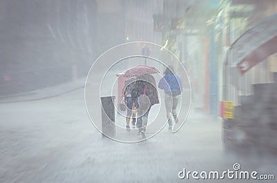 Group of girls walking at summer rain in the city Stock Photo