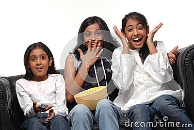 Group of girls watching TV Stock Photo