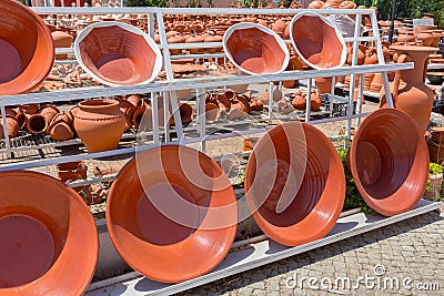 Group of glazed clay scales at pottery shop Stock Photo