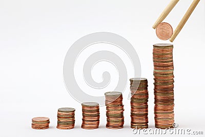 Group of gold coin graph form chopsticks Stock Photo