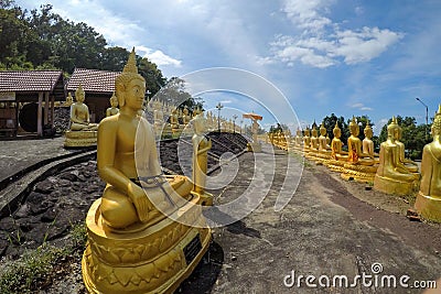 The Group of golden Buddha statues of Phu Salao temple in the Pakse city, Champasak Province, Southern Laos Stock Photo