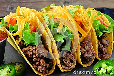 Group of ground beef hard shelled tacos close up Stock Photo