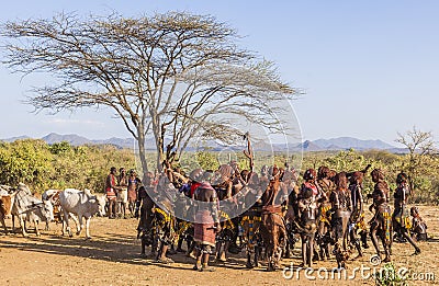 Group of Hamar women dance at bull jumping ceremony. Turmi, Omo Valley, Ethiopia. Editorial Stock Photo