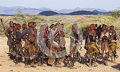 Group of Hamar women dance at bull jumping ceremony. Turmi, Omo Valley, Ethiopia. Editorial Stock Photo