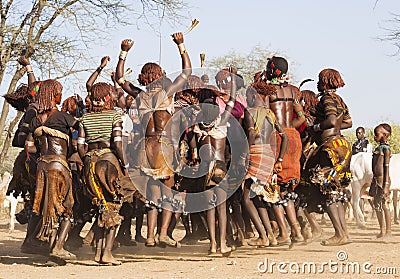 Group of Hamar women dance at bull jumping ceremony. Turmi, Omo Valley, Ethiopia. Editorial Stock Photo