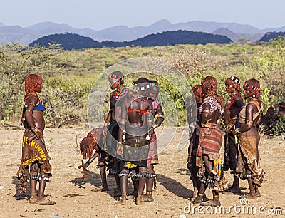 Group of Hamar women dance during bull jumping ceremony. Turmi, Omo Valley, Ethiopia. Editorial Stock Photo