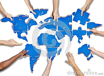 Group of Hands Holding Jigsaw Puzzle Forming World Stock Photo