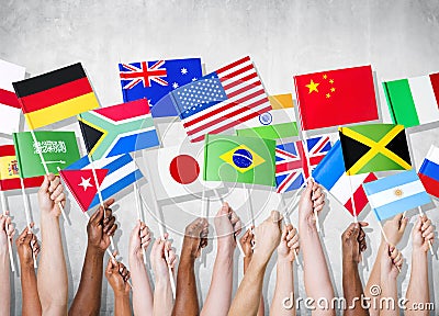 Group Of Hands Holding National Flags Stock Photo