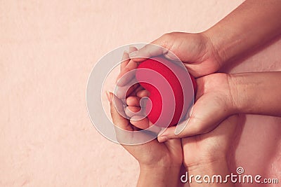 Group of hands holding red heart for V-Day love for valentine concept Stock Photo