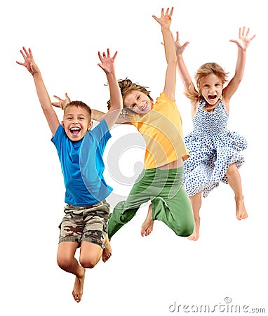 Group of happy barefeet cheerful sportive children jumping and dancing Stock Photo