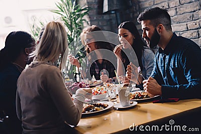 Group of happy business people eating in restaurant Stock Photo