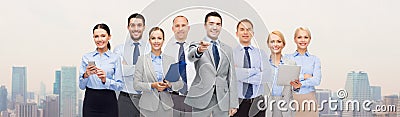 Group of happy business people pointing at you Stock Photo