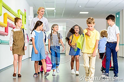 group of happy classmates walking Stock Photo