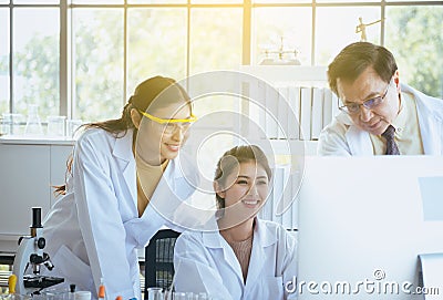 Group of happy diversity medical student research new project with senior professor together at laboratory Stock Photo